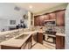 Modern kitchen with stainless steel appliances, tile backsplash, and quartz countertops at 7409 S Alkire St # 304, Littleton, CO 80127
