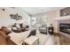 Cozy living room featuring a modern fireplace, comfortable seating, and a bright, airy atmosphere at 7409 S Alkire St # 304, Littleton, CO 80127
