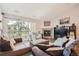 Bright and inviting living room with a fireplace, sliding glass doors, and stylish decor at 7409 S Alkire St # 304, Littleton, CO 80127