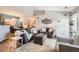 Comfortable living room with modern decor, plush seating, and plenty of natural light at 7409 S Alkire St # 304, Littleton, CO 80127
