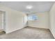 Inviting bedroom with fresh carpet, a light fixture, and a window at 8079 Wolff St # A, Westminster, CO 80031