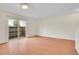 Bright living room with hardwood floors and sliding glass doors to the outside at 8079 Wolff St # A, Westminster, CO 80031