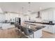 Gourmet kitchen boasts stainless steel appliances, granite countertops, and center island with seating at 89 Clara Pl, Castle Pines, CO 80108