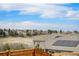 Rooftop view showcases peaceful neighborhood and stunning mountain views beyond at 89 Clara Pl, Castle Pines, CO 80108
