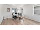Bright home office with multiple windows, a large desk, and comfortable seating for a productive workspace at 89 Clara Pl, Castle Pines, CO 80108