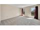 Bright bedroom featuring natural light and neutral carpeting at 1244 S Argonne Cir, Aurora, CO 80017