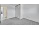 Bedroom with sliding closet doors and ensuite bathroom access at 1244 S Argonne Cir, Aurora, CO 80017