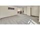 Open-concept living room with staircase access and neutral color palette at 1244 S Argonne Cir, Aurora, CO 80017