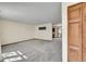 Bright and airy living room with neutral carpet and ample natural light at 1244 S Argonne Cir, Aurora, CO 80017