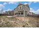 The backyard has a partially finished yard with a concrete slab for patio furniture for outdoor entertaining at 12921 E 108Th Way, Commerce City, CO 80022