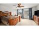 A spacious bedroom is accented by matching curtains, furniture, and a beautiful view to the outdoors at 12921 E 108Th Way, Commerce City, CO 80022