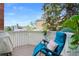 Relaxing balcony with a comfortable chair, charming décor, and views of the neighborhood at 150 Blue Spruce Ct, Highlands Ranch, CO 80126