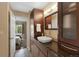 Well-lit bathroom features vanity with vessel sink and granite countertop at 150 Blue Spruce Ct, Highlands Ranch, CO 80126