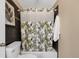 Bathroom showcasing shower/tub with palm tree design at 150 Blue Spruce Ct, Highlands Ranch, CO 80126