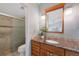 Bathroom featuring granite countertops and a glass-enclosed shower at 150 Blue Spruce Ct, Highlands Ranch, CO 80126