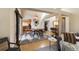 Bright dining room with modern lighting, hardwood floors, and seating for six under an open floor plan at 150 Blue Spruce Ct, Highlands Ranch, CO 80126