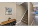 Welcoming hallway with stairs, decor, and wood-look flooring, creating a warm and inviting entrance at 150 Blue Spruce Ct, Highlands Ranch, CO 80126