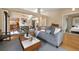 Inviting living room features neutral tones, a cozy sofa, and a seamless flow to the dining area at 150 Blue Spruce Ct, Highlands Ranch, CO 80126