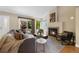 Cozy living room with a fireplace and sliding glass door to patio at 150 Blue Spruce Ct, Highlands Ranch, CO 80126