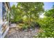 Professionally landscaped backyard with stone patio and rock beds at 10472 Longleaf Dr, Parker, CO 80134
