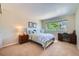 Cozy bedroom with a large window offering natural light and neutral color palette at 10472 Longleaf Dr, Parker, CO 80134