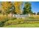 Stonegate community entrance sign surrounded by colorful flowers and lush landscaping at 10472 Longleaf Dr, Parker, CO 80134