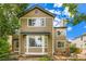 Two-story home with neutral siding, white trim, a bay window, and outdoor patio furniture at 10472 Longleaf Dr, Parker, CO 80134
