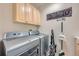 Laundry room features a front loading washer and dryer and decor at 10472 Longleaf Dr, Parker, CO 80134