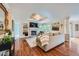 The inviting living area includes a cozy fireplace, built-in shelving, and bright windows at 10472 Longleaf Dr, Parker, CO 80134