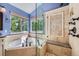 Bright bathroom showcases a soaking tub, walk-in shower, and natural light at 10472 Longleaf Dr, Parker, CO 80134