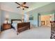 Bright main bedroom featuring a vaulted ceiling, soft carpet, and ensuite at 10472 Longleaf Dr, Parker, CO 80134
