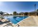Community lap pool with diving board, clubhouse, bath house, and ample room to sunbathe at 10472 Longleaf Dr, Parker, CO 80134