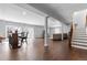 Finished basement with wood floors, bar and stairs, perfect for entertaining and relaxing at 9060 Ferncrest St, Firestone, CO 80504