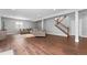 Bright finished basement showcasing a comfortable seating area with a staircase and stylish decor at 9060 Ferncrest St, Firestone, CO 80504