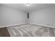 This bedroom features neutral walls, carpet and white trim, ready for your personal touch at 9060 Ferncrest St, Firestone, CO 80504