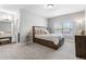 Comfortable bedroom with carpet, neutral walls, window with blinds, and desk at 9060 Ferncrest St, Firestone, CO 80504