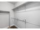 Walk-in closet featuring ample storage space and closet rod at 9060 Ferncrest St, Firestone, CO 80504