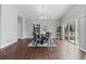 Bright dining room with wood floors, gray walls, and sliding glass doors to the outside at 9060 Ferncrest St, Firestone, CO 80504