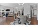 Open concept dining room flows into the living room and kitchen at 9060 Ferncrest St, Firestone, CO 80504