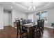 Spacious dining room with seating for eight and modern lighting at 9060 Ferncrest St, Firestone, CO 80504