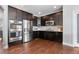 Kitchen featuring stainless steel appliances and dark wood cabinets at 9060 Ferncrest St, Firestone, CO 80504