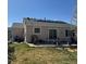 Backyard features lawn, patio, solar panels and sliding glass door at 15603 E 51St Pl, Denver, CO 80239
