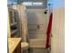 Small bathroom with white shower/tub combo, a window, and a toilet and vanity at 15603 E 51St Pl, Denver, CO 80239