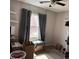Neutral bedroom with boxes, cat tree and laminate flooring at 15603 E 51St Pl, Denver, CO 80239