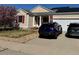 Charming home with a two-car garage, solar panels, and a well-maintained lawn at 15603 E 51St Pl, Denver, CO 80239