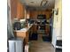Kitchen features wooden cabinets, stainless steel appliances and laminate flooring at 15603 E 51St Pl, Denver, CO 80239