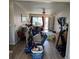 View of living room that needs decluttering and features wood laminate flooring at 15603 E 51St Pl, Denver, CO 80239