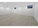 Spacious basement with neutral carpet, recessed lighting, and bright white walls at 9639 W 63Rd Pl, Arvada, CO 80004