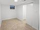Finished basement area with patterned floors and doors to a closet and entry at 9639 W 63Rd Pl, Arvada, CO 80004