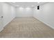 Large basement featuring neutral carpet, white walls, and recessed lighting at 9639 W 63Rd Pl, Arvada, CO 80004